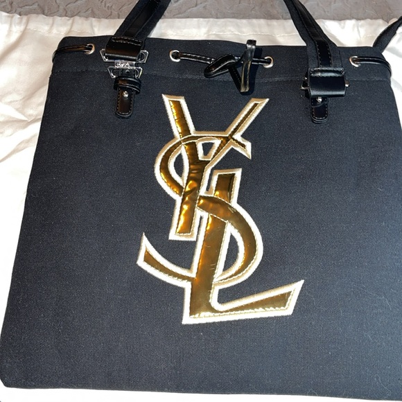Yves Saint Laurent Handbags - Brand new YSL novelty shoulder bag excellent condition black with gold letters.